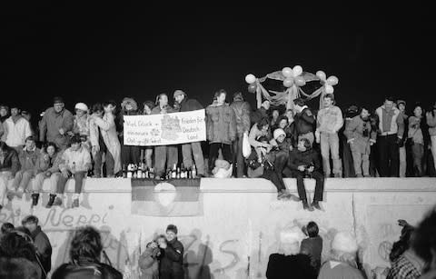 people celebrate end of berlin wall - Credit: Getty