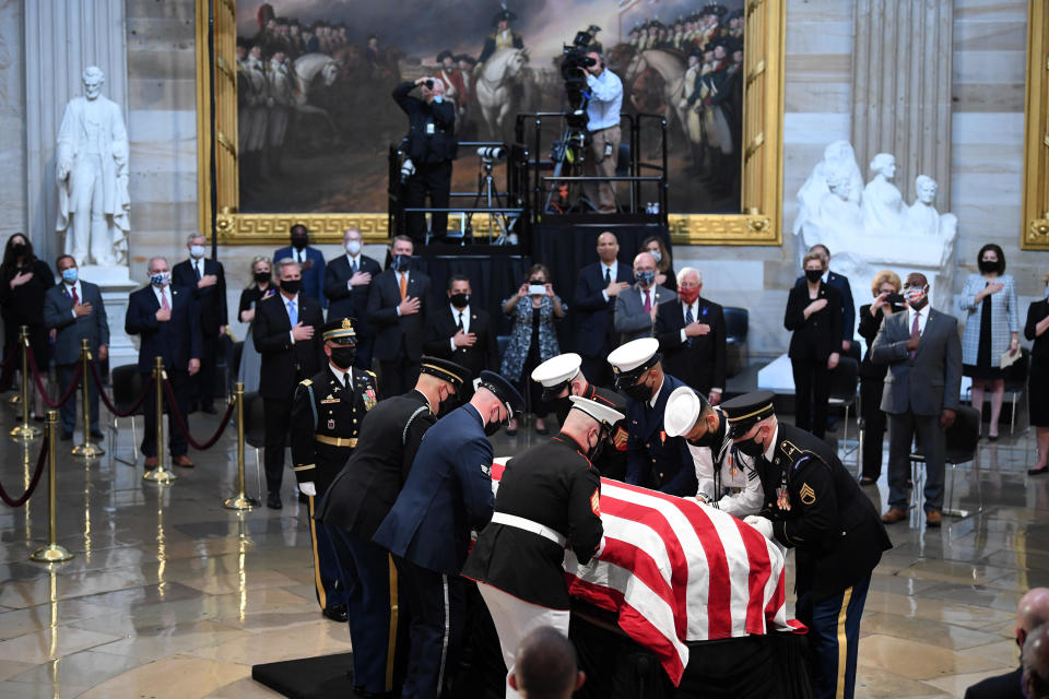 Military Honor Guard places the casket of Congressman John Lewis (D- GA) at the beginning of a memorial service in the Rotunda of the U.S. Capitol in Washington, D.C., U.S. July 27, 2020.  / Credit: Matt McClain/Pool via POOL / REUTERS