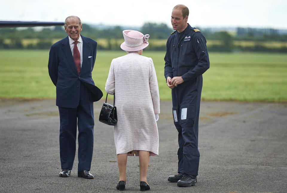 CAMBRIDGE, ENGLAND - JULY 13:  Prince William, Duke of Cambridge gives Queen Elizabeth II and Prince Philip, Duke of Edinburgh a tour as she opens the new East Anglian Air Ambulance Base at Cambridge Airport on July 13, 2016 in Cambridge, England.  (Photo by Niklas Halle'n - WPA Pool/Getty Images)