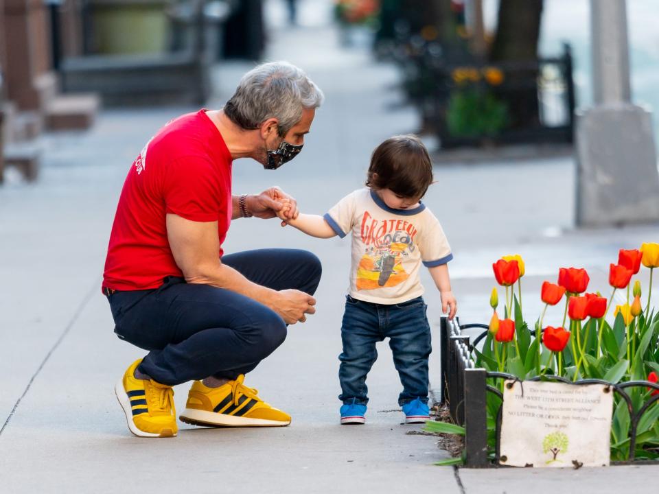 Andy Cohen on a walk with his son.