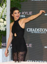 <p>On the last day promoting her Kendall + Kylie with her younger sister in Australia, Jenner wore a solid black jumpsuit with lace legs. This is a relatively modest look for the model, who usually exposes a lot more skin—but the halter top really suits her long and lean frame. Sheer pants are certainly a favorite of Jenner’s family: Her mom <a href="http://assets.nydailynews.com/polopoly_fs/1.2093461!/img/httpImage/image.jpg_gen/derivatives/gallery_1200/kim-kardashian-kris-jenner.jpg" rel="nofollow noopener" target="_blank" data-ylk="slk:Kris and half-sister Kim;elm:context_link;itc:0;sec:content-canvas" class="link ">Kris and half-sister Kim</a> Kardashian have both worn similar styles, and her first collection for Topshop with Kylie also <a href="http://static1.squarespace.com/static/54f61f11e4b01df492af63b0/t/556f5b64e4b0f06d82ffeebc/1433361255661/Kendall+%26+Kylie+Jenner+Topshop+Collection+-+Black+sheer+palazzo+pants+%C2%A340+-+Running+In+Heels+Irish+Fashion+Blog" rel="nofollow noopener" target="_blank" data-ylk="slk:included a pair of sheer pants;elm:context_link;itc:0;sec:content-canvas" class="link ">included a pair of sheer pants</a>. <i>(Photo: Getty)</i></p>