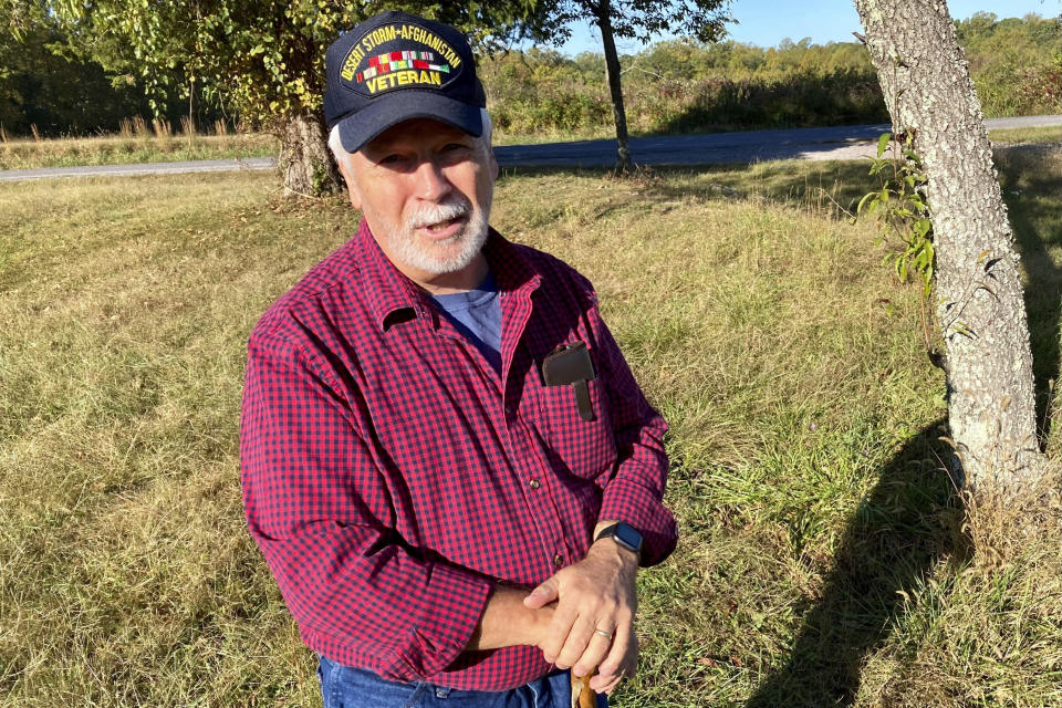 In this Oct. 20, 2021, photo Greg Eanes, a retired Air Force colonel and resident of Crewe, Va., poses for a photo at Sailor’s Creek Battlefield State Park in Rice, Va. Eanes said he sees removing the Pickett name at Fort Pickett as disrespecting the rebels and their descendants. “In my opinion, it is nothing less than cultural genocide, albeit with a velvet glove,” he says, standing beside a still-visible Confederate trench on a battlefield in an adjacent county. “The South has a unique history. Many of its people have ancestors and family members who were in the Confederate armies. It would be wrong, in my opinion, to dismiss — just arbitrarily dismiss — their concerns.”(AP Photo/Robert Burns)