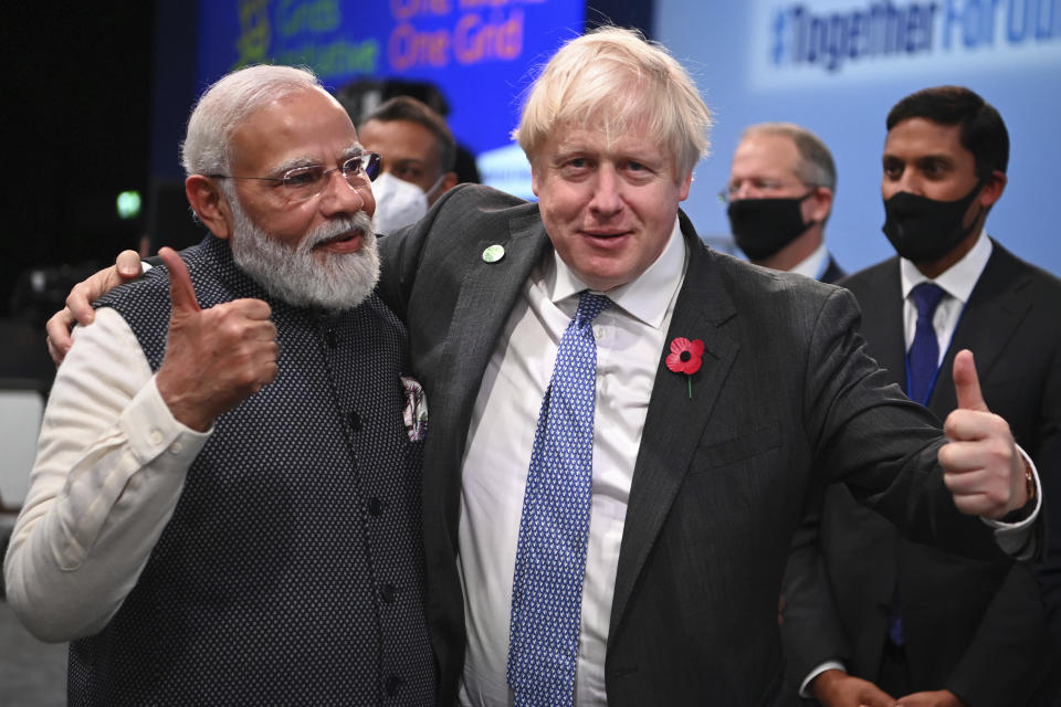 Britain's Prime Minister Boris Johnson, right, and India's Prime Minister Narendra Modi attend the World Leaders' Summit "Accelerating Clean Technology Innovation and Deployment", at the COP26 Summit, in Glasgow, Scotland, Tuesday, Nov. 2, 2021. The U.N. climate summit in Glasgow gathers leaders from around the world, in Scotland's biggest city, to lay out their vision for addressing the common challenge of global warming. (Jeff J Mitchell/Pool Photo via AP)