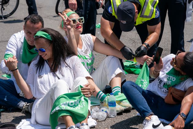 Busy Philipps flashes a peace sign while being detained during an act of civil disobedience on Constitution Avenue. (Photo: Jacquelyn Martin via AP)