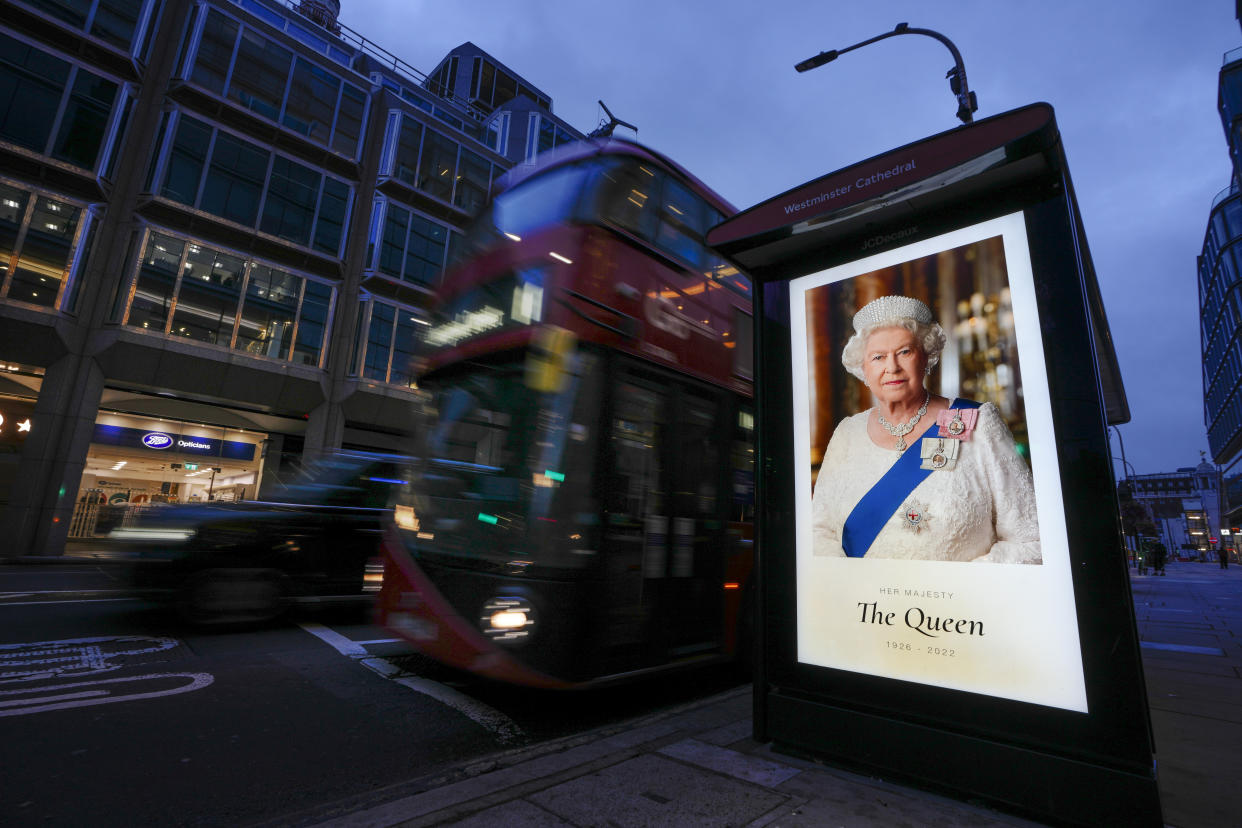 A picture of Queen Elizabeth sits on a bus stop in London, Friday, Sept. 9, 2022. (AP Photo/Kirsty Wigglesworth)