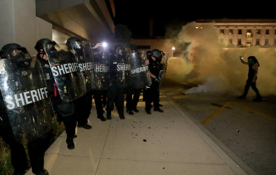 Aug 23, 2020; Kenosha, WI, USA; Protestor confront Kenosha County Sheriffs Deputies outside the Kenosha Police Department in Kenosha on Sunday, Aug. 23, 2020. Kenosha police shot a man Sunday evening, setting off unrest in the city after a video appeared to show the officer firing several shots at close range into the man's back. Mandatory Credit: Mike De Sisti/Milwaukee Journal Sentinel via USA TODAY NETWORK/Sipa USA