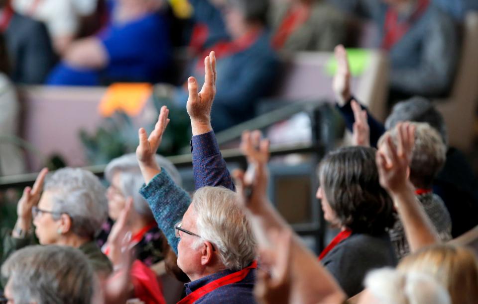 People vote on a motion during a special called session of the Oklahoma United Methodist Conference in April 2023. A judge has ordered Oklahoma United Methodist Bishop Jimmy Nunn to re-create the April meeting so that delegates may consider First United Methodist Church of Oklahoma City's disaffiliation request.