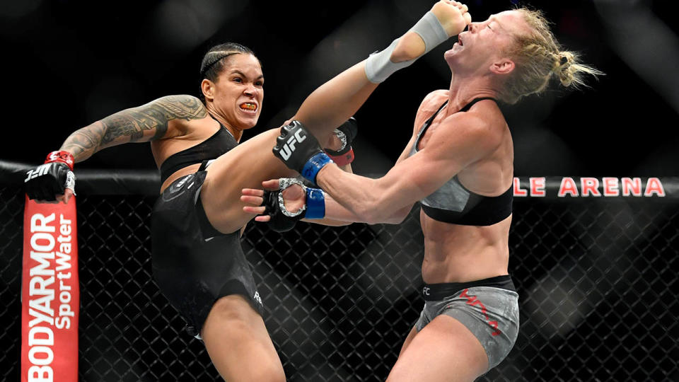 Amanda Nunes kicks Holly Holm in the head in a stunning KO. (Photo by Jeff Bottari/Zuffa LLC/Zuffa LLC via Getty Images)