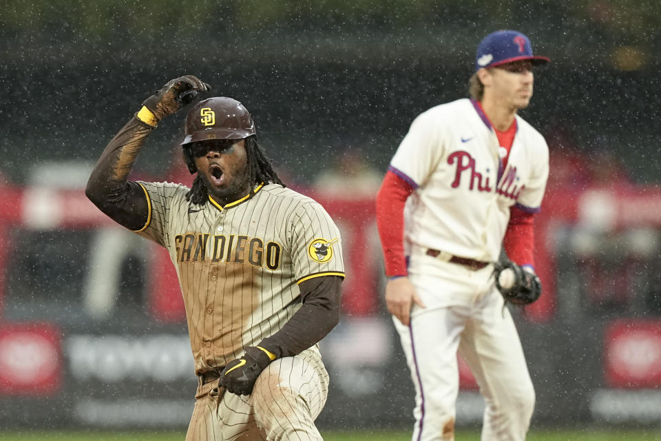 San Diego Padres' Josh Bell celebrates his RBI-double during the seventh inning in Game 5 of the baseball NL Championship Series between the San Diego Padres and the Philadelphia Phillies on Sunday, Oct. 23, 2022, in Philadelphia. (AP Photo/Brynn Anderson)