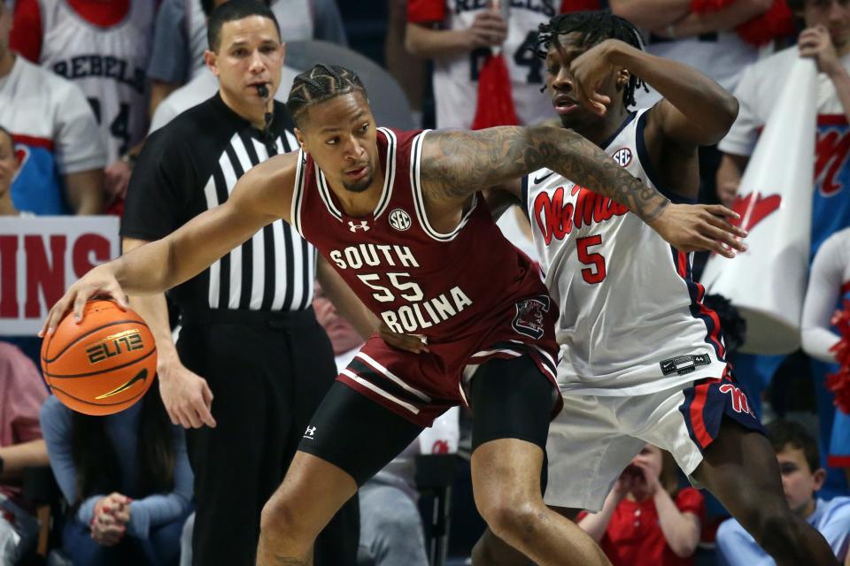 Feb 24, 2024; Oxford, Mississippi, USA; South Carolina Gamecocks guard Ta'Lon Cooper (55) dribbles as Mississippi Rebels guard Jaylen Murray (5) defends during the second half at The Sandy and John Black Pavilion at Ole Miss. Mandatory Credit: Petre Thomas-USA TODAY Sports
