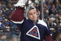 Colorado Avalanche goaltender Justus Annunen pulls on his helmet after a timeout in the second period of an NHL hockey game against the Winnipeg Jets, Saturday, April 13, 2024, in Denver. (AP Photo/David Zalubowski)