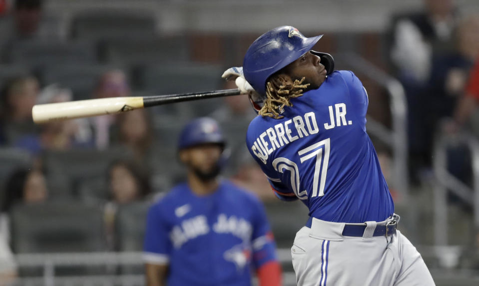 Toronto Blue Jays' Vladimir Guerrero Jr. swings for a home run off Atlanta Braves' Bryse Wilson in the sixth inning of a baseball game Tuesday, May 11, 2021, in Atlanta. (AP Photo/Ben Margot)