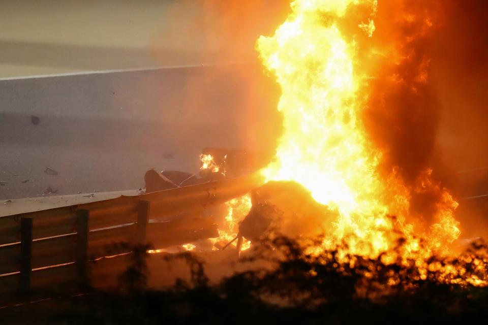 <p>Grosjean’s car erupted into flames after hitting the barrier</p>AFP via Getty