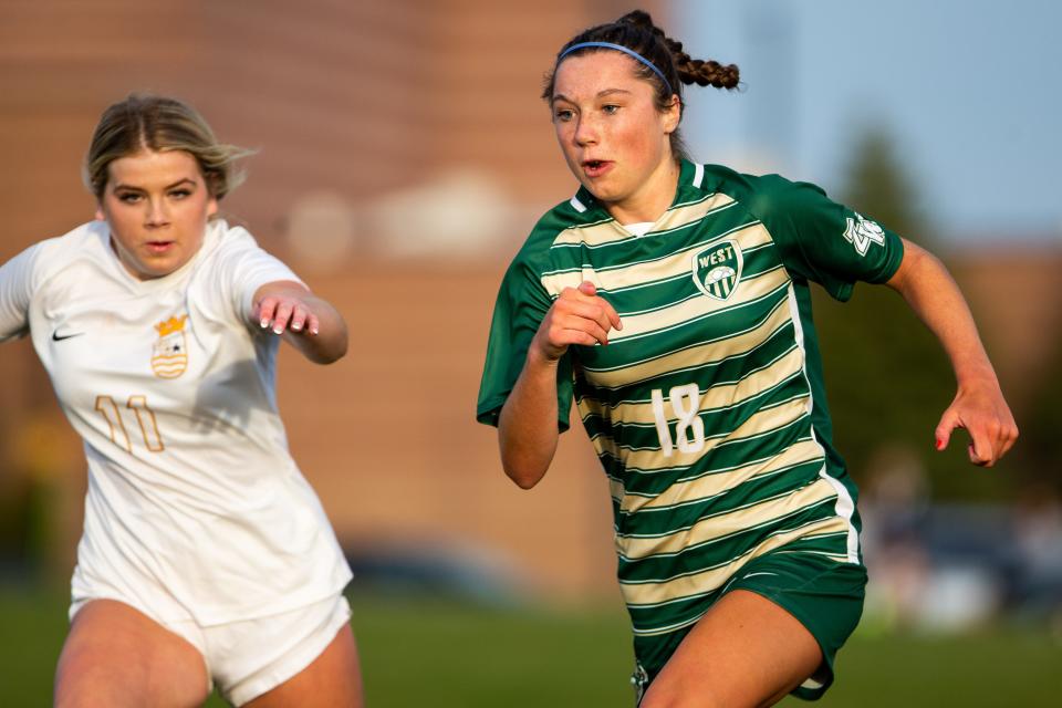 West's Jordyn Klaasen runs down the pitch Tuesday, April 11, 2023, at Zeeland West. 