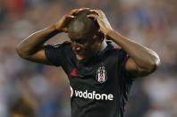 Besiktas' Demba Ba reacts after missing a goal scoring opportunity during the first leg of their Champions League qualifying soccer match against Arsenal at Ataturk Olympic stadium in Istanbul August 19, 2014. REUTERS/Murad Sezer