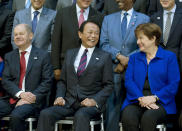From left, German Finance Minister Olaf Scholz, Japan's Finance Minister Taro Aso and International Monetary Fund (IMF) Managing Director Kristalina Georgieva during the International Monetary Fund IMF Governors group photo a at the World Bank/IMF Annual Meetings in Washington, Saturday, Oct. 19, 2019. (AP Photo/Jose Luis Magana)
