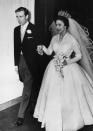 <p>The Queen's younger sister wore a long-sleeve silk organza wedding dress designed by Norman Hartnell when she married Antony Armstrong-Jones. The Princess paired the simple dress with the Poltimore tiara and a cathedral length veil. </p>