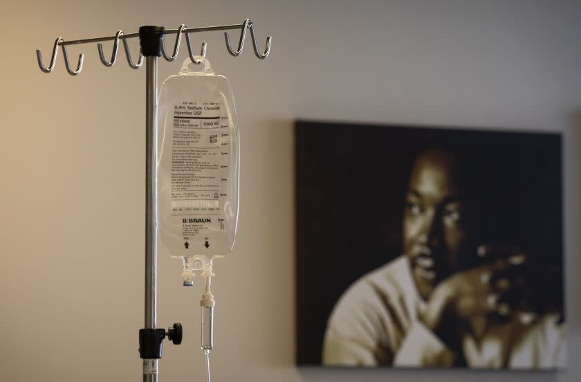 LOS ANGELES, CA - APRIL 15: During the coroniavirus global pandemic an IV bag hangs at Martin Luther King, Jr., Community Hospital on Wednesday, April 15, 2020 in the Emegancy Department in Los Angeles, CA. The IV bag is near a portrait of Dr. Martin Luther King. Martin Luther King, Jr., Community Hospital (MLKCH) is located in the Willowbrook neighborhood of South Los Angeles located between Compton and Watts. The hospital opened in 2015, replacing old Martin Luther King Jr./Drew Medical Center. (Francine Orr / Los Angeles Times)