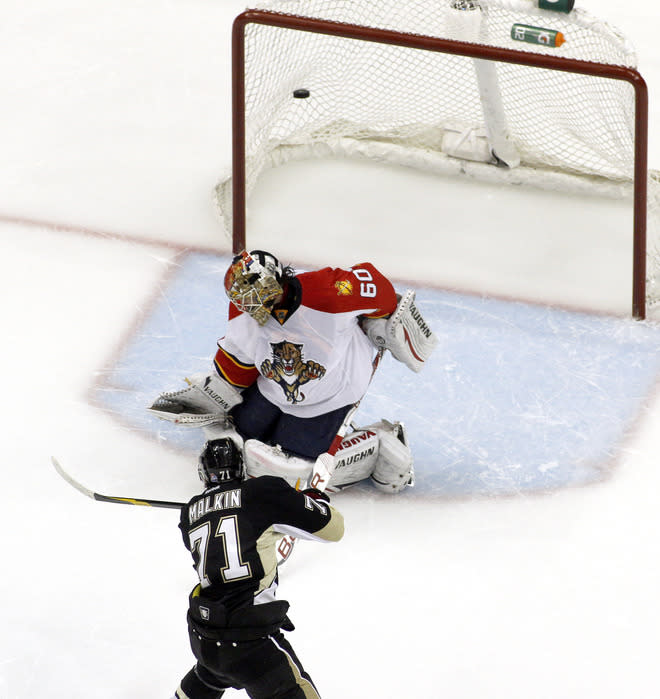 PITTSBURGH, PA - MARCH 9: Evgeni Malkin #71 of the Pittsburgh Penguins scores past Jose Theodore #60 of the Florida Panthers during the shootout at Consol Energy Center on March 9, 2012 in Pittsburgh, Pennsylvania. The Penguins defeated the Panthers 2-1 in a shootout. (Photo by Justin K. Aller/Getty Images)