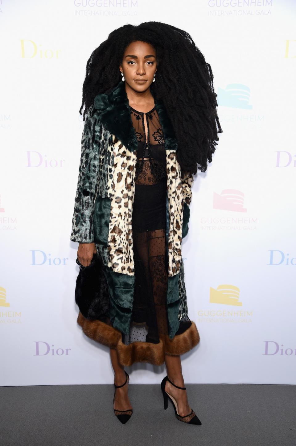 <p>TK Quann’s sheer dress with fur trim was an absolute winner! The printed coat and sheer-panel pumps were perfect additions to her look. </p>