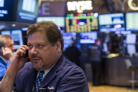 A trader waits to see when trading will resume on the floor of the New York Stock Exchange following a halt in trading on the floor of the exchange in New York, July 8, 2015. REUTERS/Lucas Jackson