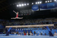 Guan Chenchen, of China, performs on the balance beam during the artistic gymnastics women's apparatus final at the 2020 Summer Olympics, Tuesday, Aug. 3, 2021, in Tokyo, Japan. (AP Photo/Gregory Bull)