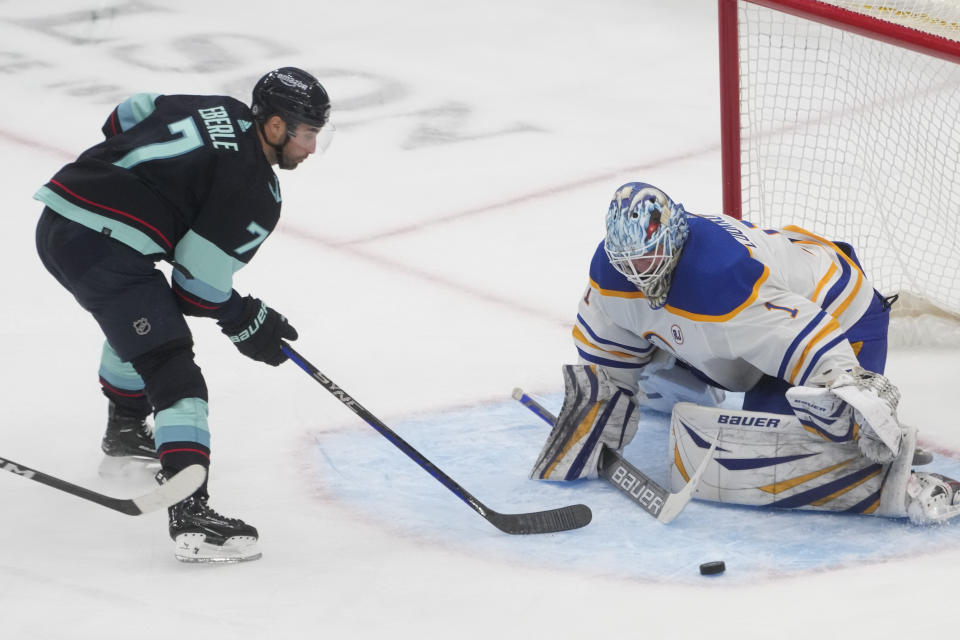 Seattle Kraken right wing Jordan Eberle (7) watches his shot attempt get blocked by Buffalo Sabres goaltender Ukko-Pekka Luukkonen, right, during the third period of an NHL hockey game Monday, March 18, 2024, in Seattle. The Sabres won 6-2. (AP Photo/Lindsey Wasson)