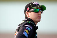 HOMESTEAD, FL - NOVEMBER 19: Kyle Busch, driver of the #18 Interstate Batteries Toyota, walks on the grid during qualifying for the NASCAR Sprint Cup Series Ford 400 at Homestead-Miami Speedway on November 19, 2011 in Homestead, Florida. (Photo by Todd Warshaw/Getty Images for NASCAR)