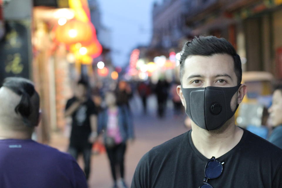 Urban picture of young man with pollution mask.