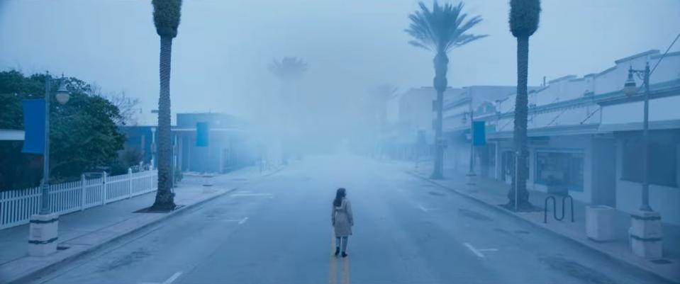 A woman investigates a foggy, empty island town in "Offseason"