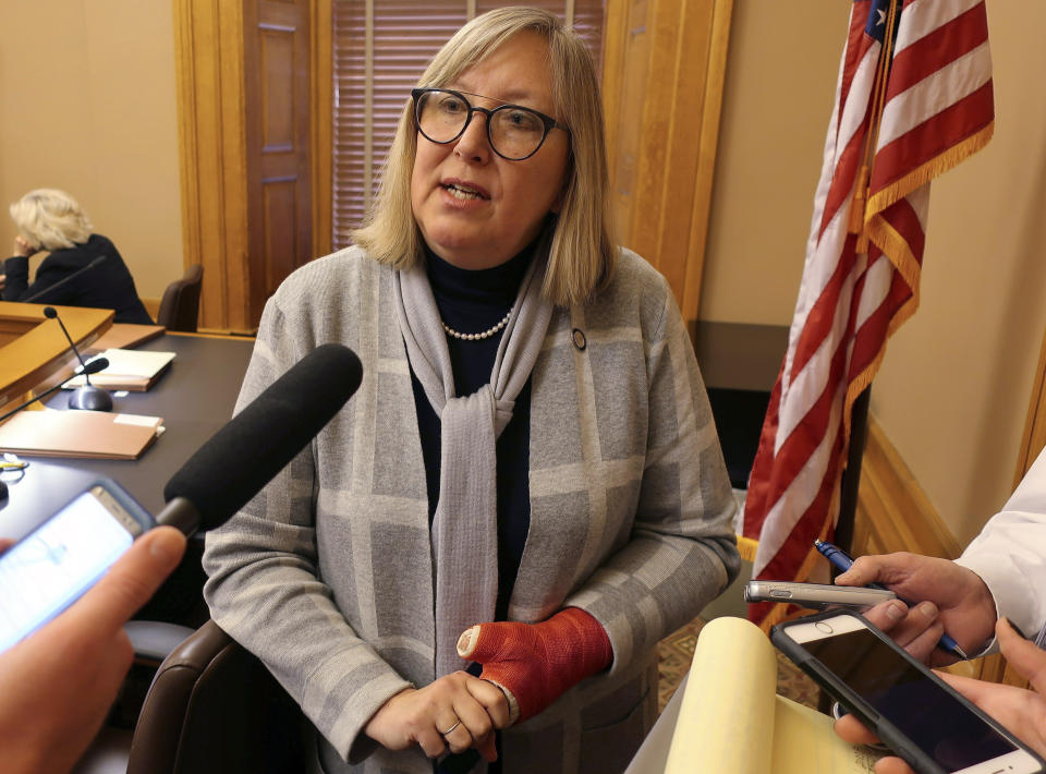 Kansas state Sen. Molly Baumgardner, R-Louisburg, the chairwoman of a Senate committee on school funding, answers questions from reporters, Wednesday, March 6, 2019, at the Statehouse in Topeka, Kansas. Baumgardner's committee has endorsed Democratic Gov. Laura Kelly's plan for boosting spending on public schools. (AP Photo/John Hanna)