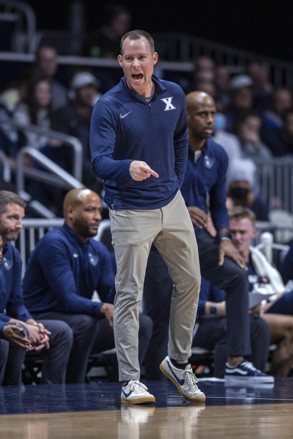 Xavier coach Travis Steele reacts to a call by the officials during the first half of the team's NCAA college basketball game against Butler, Friday, Jan. 7, 2022, in Indianapolis. (AP Photo/Doug McSchooler)