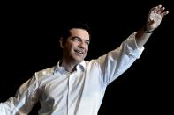 Greek Prime Minister Alexis Tsipras waves to supporters during a rally in central Athens, on July 3, 2015