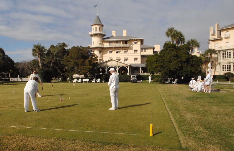 In January 2008, men and women dressed in white play croquet in front of the Jekyll Island Club, once the winter playground of the truly rich and famous.