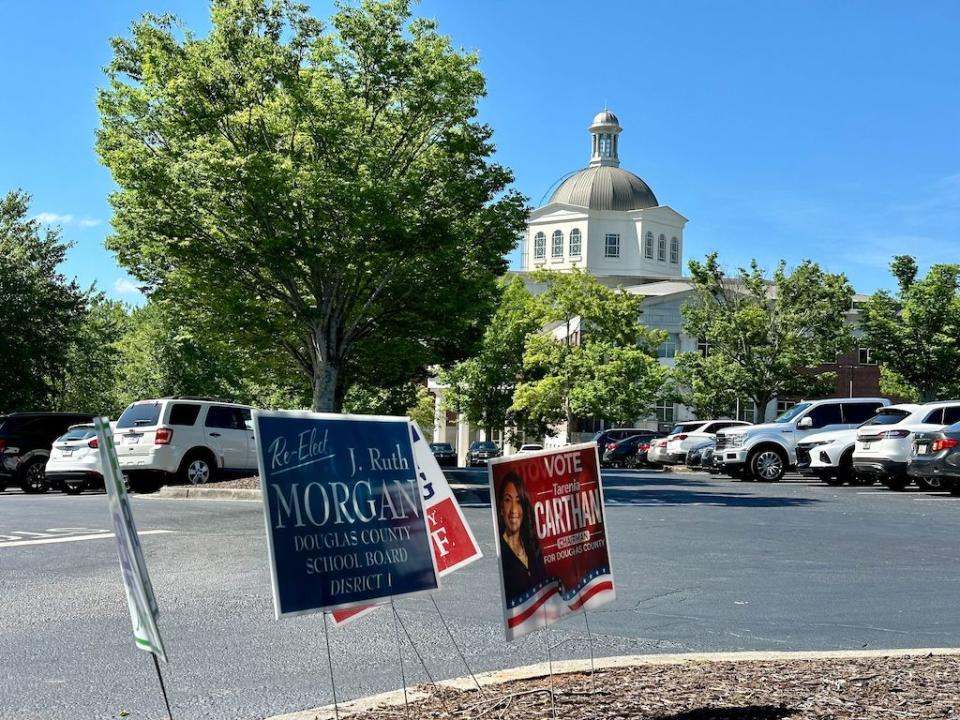  The elections staff for Douglas County, Ga., work behind locked doors in the basement of the domed courthouse in Douglasville, Ga. (Matt Vasilogambros/Stateline)