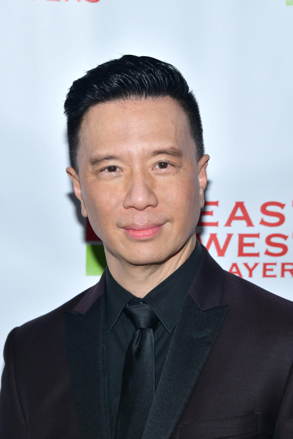 Reggie Lee looks into the camera