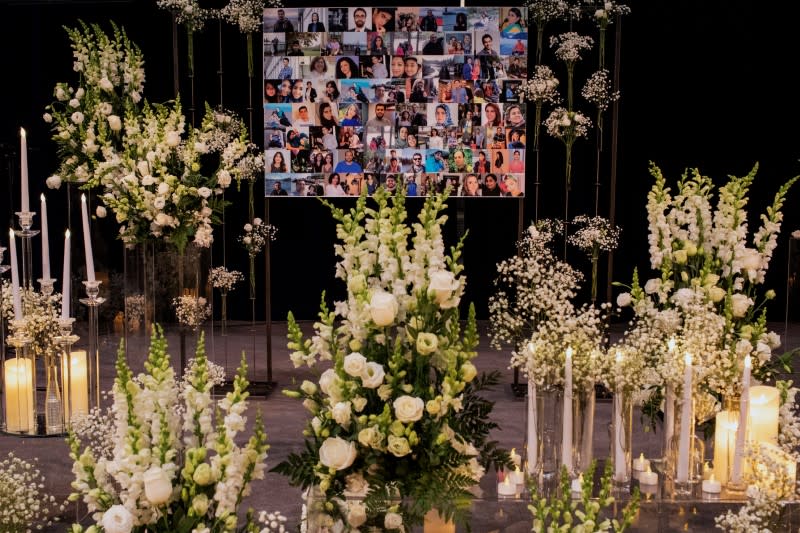 Mourners attend a memorial for the victims of a Ukrainian passenger plane which was shot down in Iran