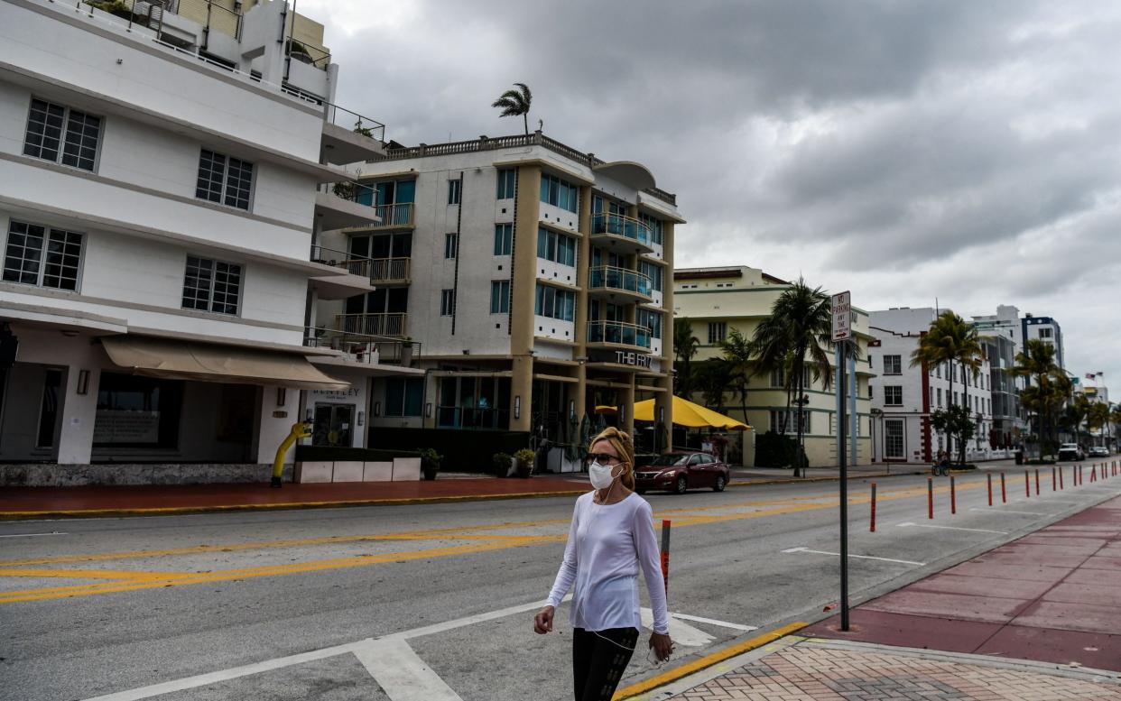 A deserted street in Miami, Florida. Experts warn that the coronavirus could be "endemic in our communities" - CHANDAN KHANNA/AFP via Getty Images