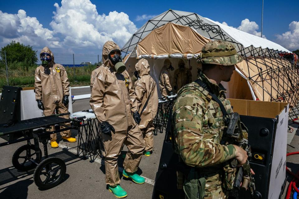 Ukrainian Emergency Ministry personnel conducted a drill in the city of Zaporizhzhia on Aug. 17, 2022, to prepare for a possible radiation leak from the nuclear power plant near the city. <a href="https://www.gettyimages.com/detail/news-photo/ukrainian-emergency-ministry-rescuers-attend-an-exercise-in-news-photo/1242554458" rel="nofollow noopener" target="_blank" data-ylk="slk:Photo by Dimitar Dilkoff/AFP via Getty Images;elm:context_link;itc:0;sec:content-canvas" class="link ">Photo by Dimitar Dilkoff/AFP via Getty Images</a>