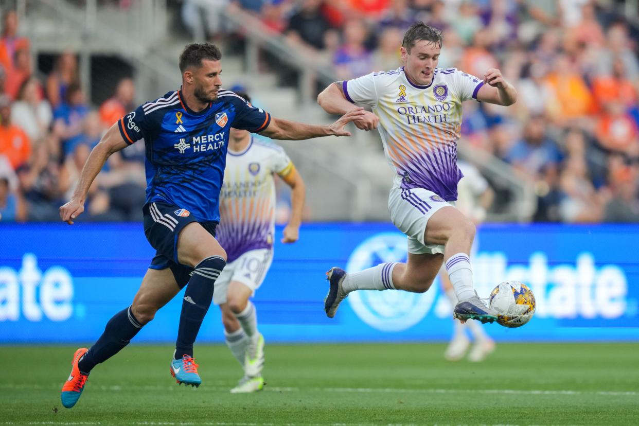 Matt Miazga, left, defends against Orlando City SC midfielder Dagur Thorhallsson (23) during a Sept. 2, 2023 match at TQL Stadium. Miazga was named the 2023 MLS Defender of the Year while being investigated by the league for an alleged post-match incident following FC Cincinnati's win in penalty kicks Nov. 4 against New York Red Bulls.