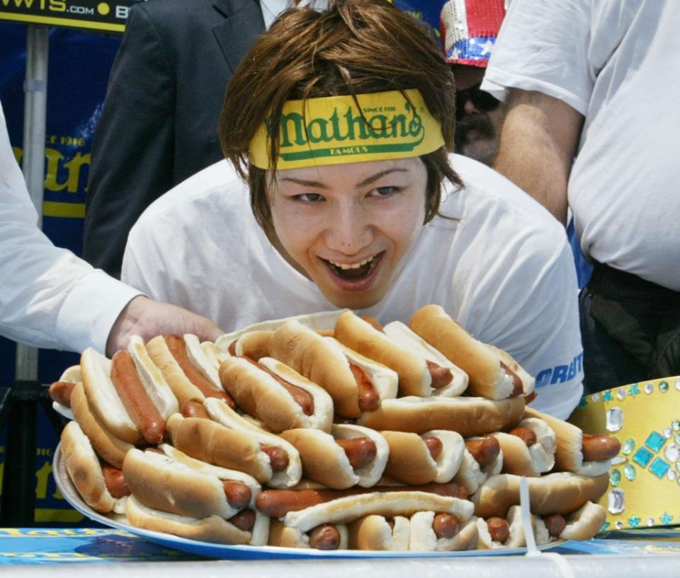 Kobayashi is pictured at the Coney Island eating contest in 2003. That year, he scored victory by chowing down on 44.5 hot dogs in 12 minutes. Getty Images