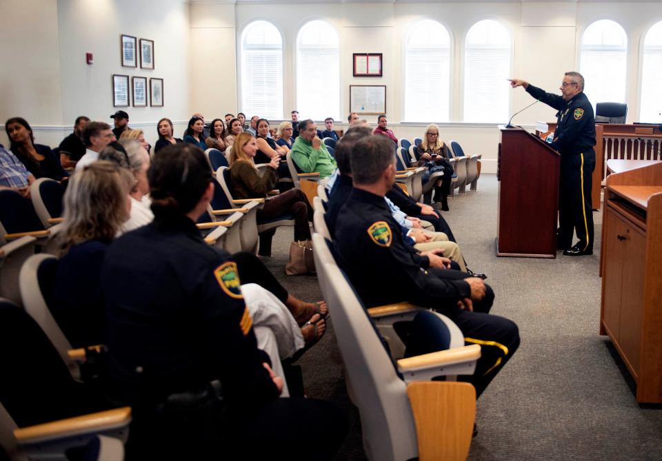 Palm Beach Police Chief Nicholas Caristo begins the police department promotional and awards ceremony at the Town Council chambers Friday.