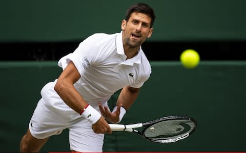 Novak Djokovic of Serbia serves against Roberto Bautista-Agut of Spain during Day 11 of The Championships - Wimbledon 2019 at All England Lawn Tennis and Croquet Club.  - Credit: Getty Images