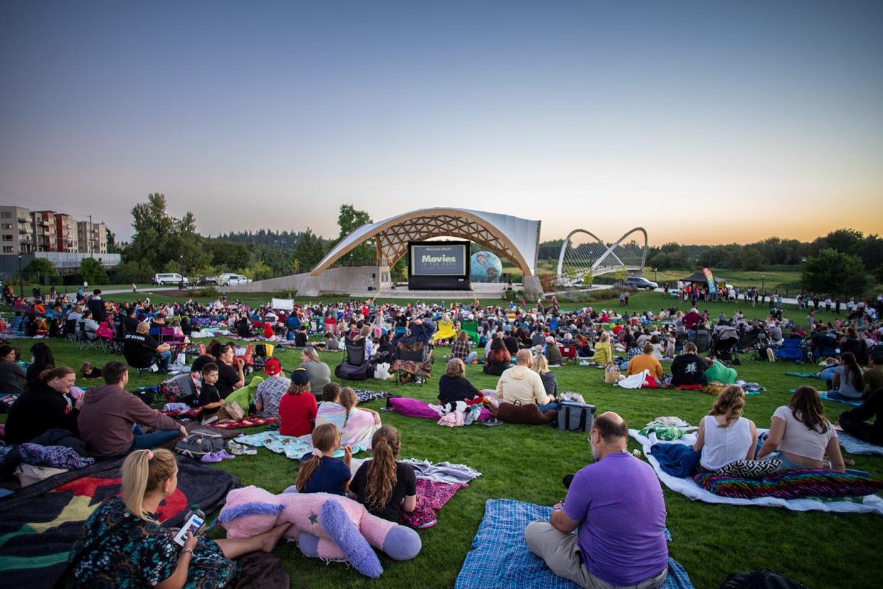 Parkgoers attend a Movies at the Park screening in Riverfront Park's Gerry Frank Rotary Amphitheater posted in 2023.
