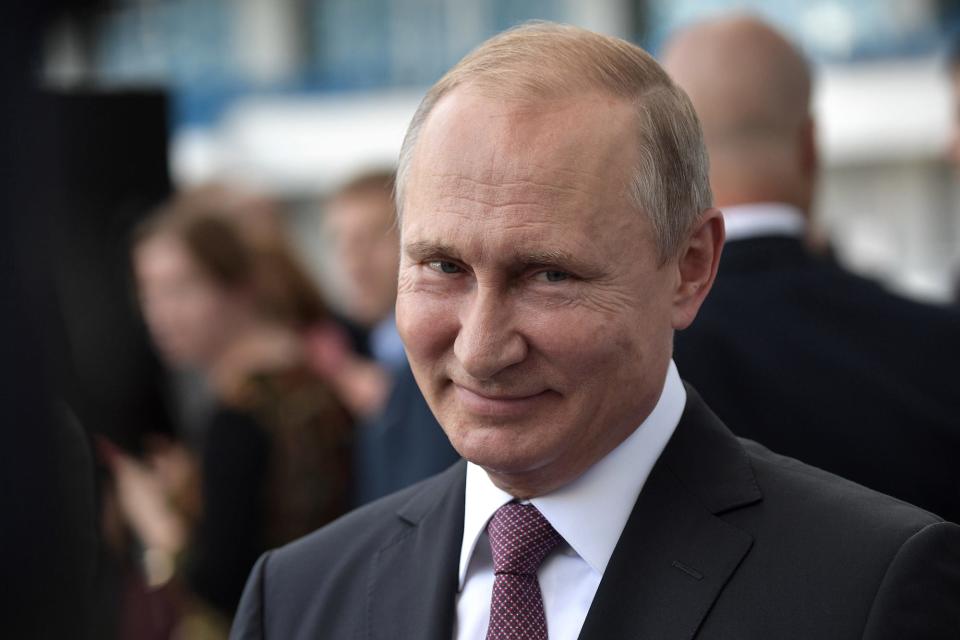 Vladimir Putin grinning