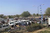 Civilians arrive for shelter at the United Nations Mission in the Republic of South Sudan (UNMISS) compound in Bor, South Sudan in this December 18, 2013 picture provided by the UNMISS. South Sudan's army said it had lost control of the flashpoint town of Bor on Wednesday, its first acknowledged reversal in three days of clashes between rival groups of soldiers that have triggered warnings of a slide into civil war. REUTERS/UNMISS/Handout via Reuters