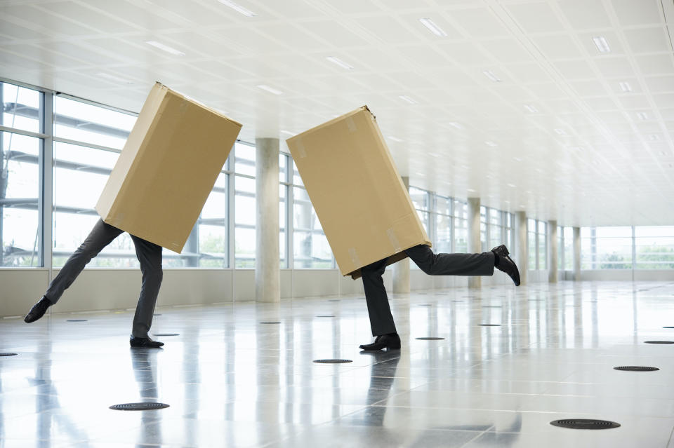 Portrait of two men in cardboard boxes