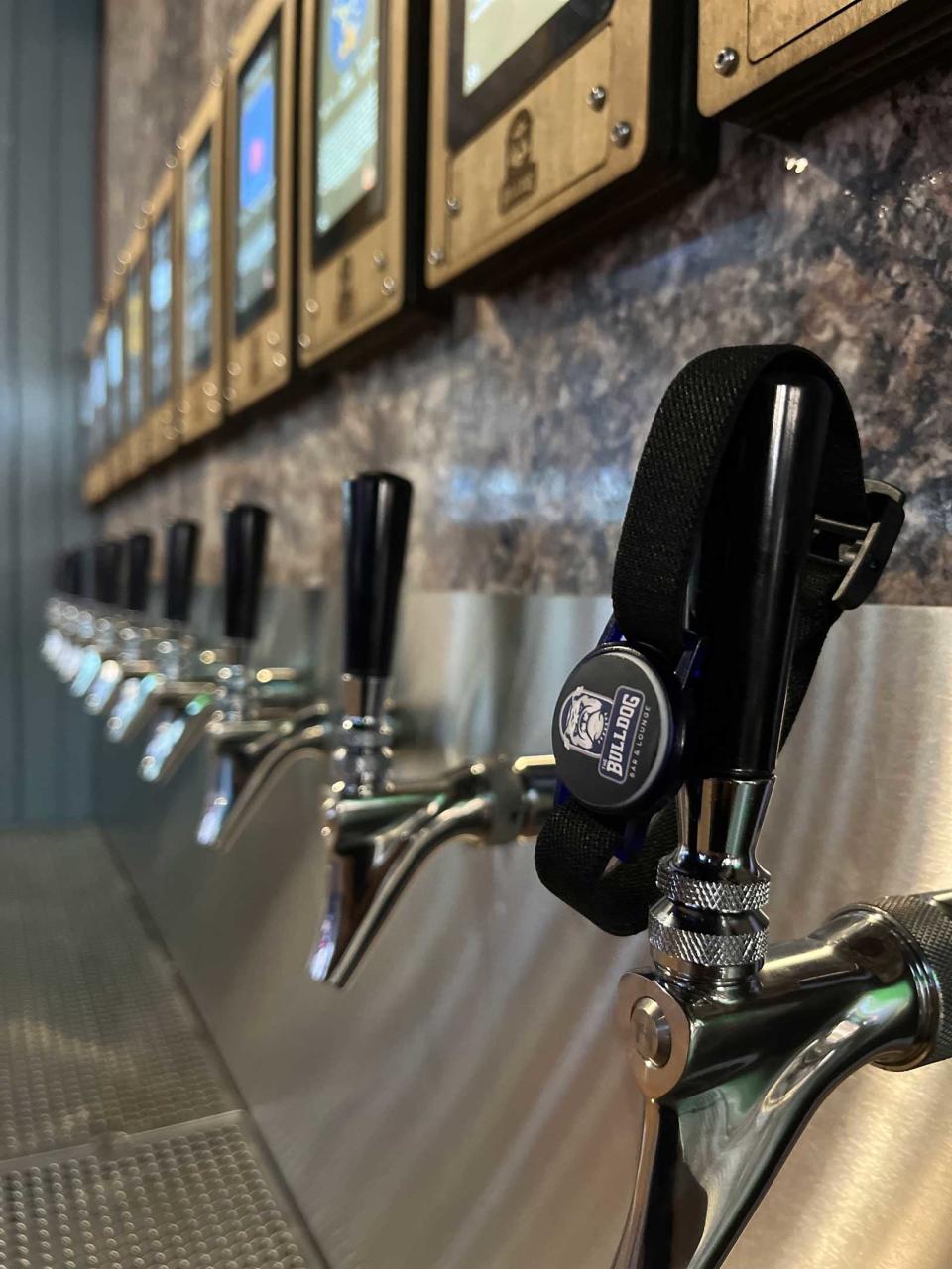 Self-pour taps are a feature of the new The Bulldog Bar & Lounge at 5380 N. College Ave., Indianapolis.