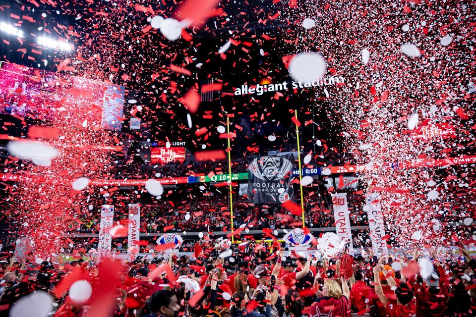 Utah Utes players celebrate after they beat the Oregon Ducks in the Pac-12 championship game.