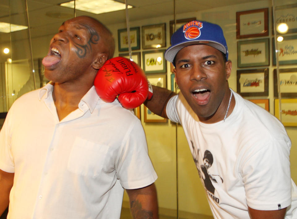 (L-R) Mike Tyson and DJ Whoo Kid invade “The Whoolywood Shuffle” at SiriusXM Studio on August 9, 2012 in New York City.